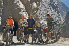 Five cyclists heading south through Canyon Del Pato